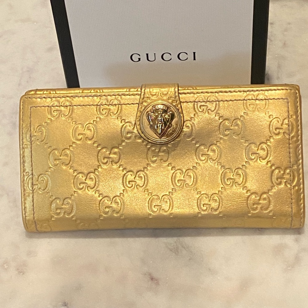 Gucci Gold Bag with Iconic GG Monogram and Feline Detail